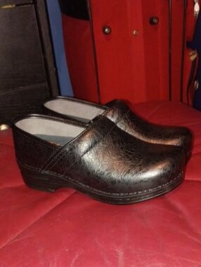 Dansko Black Floral-Embossed Leather Clogs